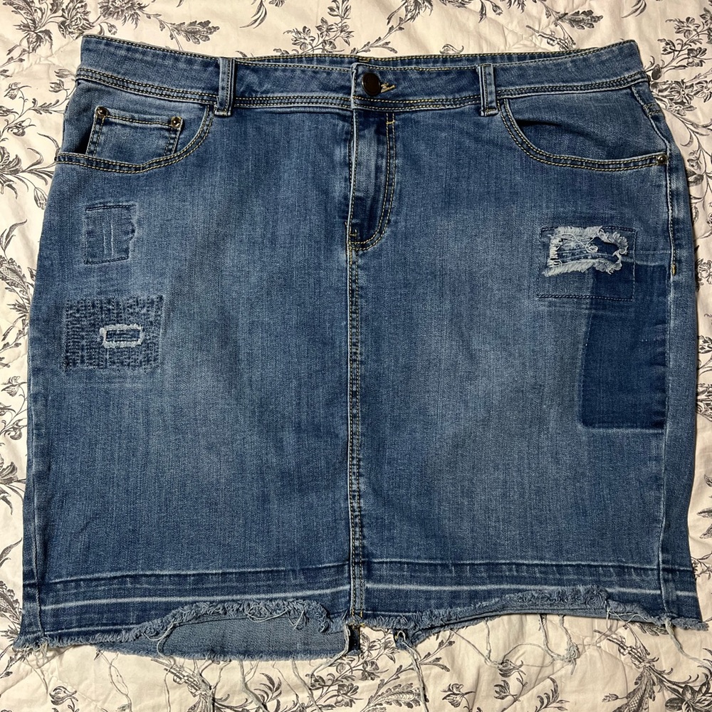 Distressed denim mini skirt